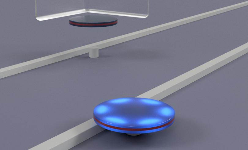 Microdisk transferred onto Si waveguide via microtip